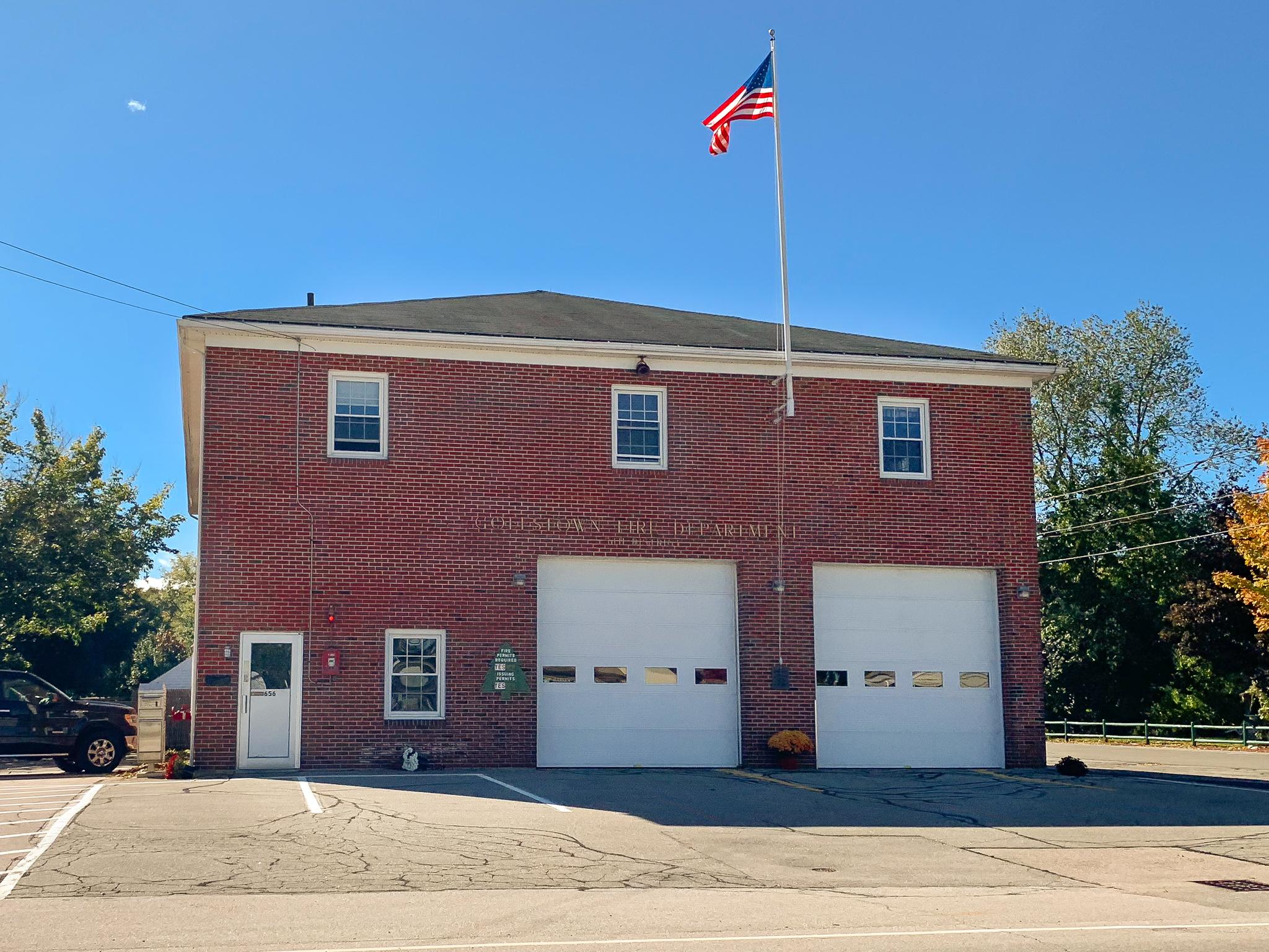 Brick firehouse against a blue sky
